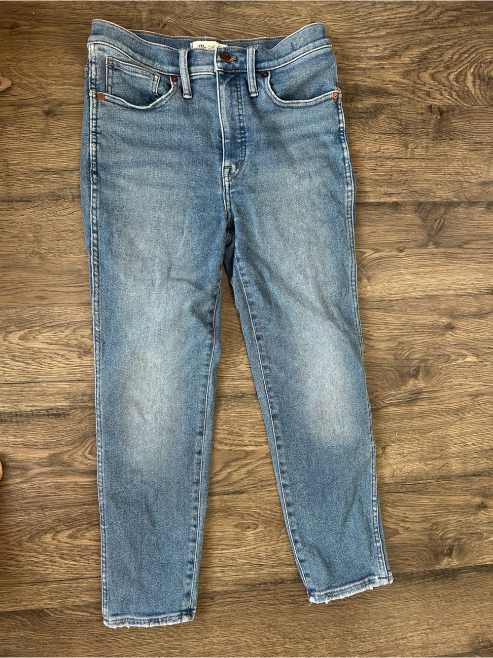 Madewell light blue denim jeans with copper accents stovepipe